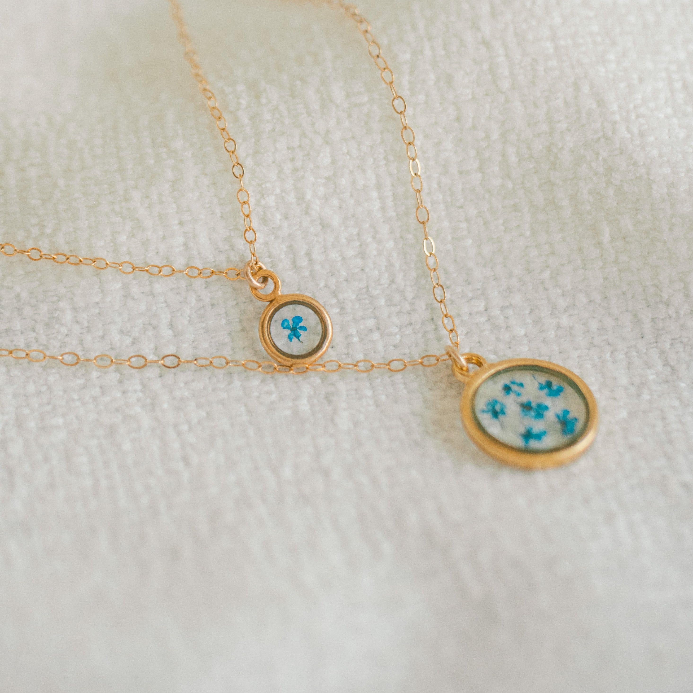 Sentimental mini birth flower necklace paired with birth flower necklace 